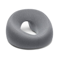Coussin face vers le bas gris en mousse à mémoire de forme, ouverture pour le visage, sur fond blanc