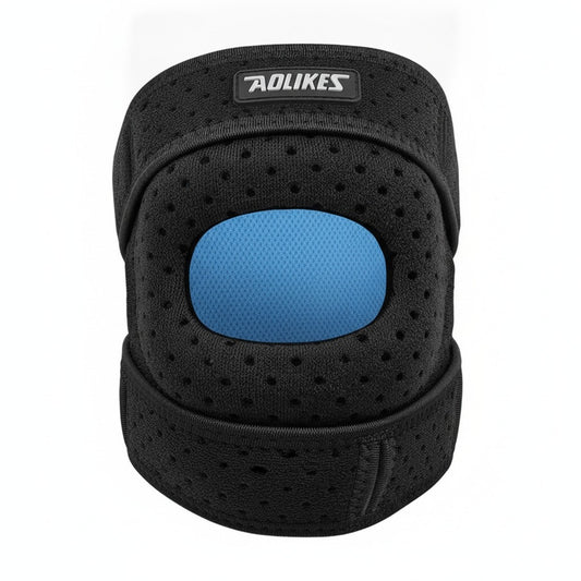 Genouillère rotulienne réglable noire vue de face, rotule dégagée, sur fond blanc