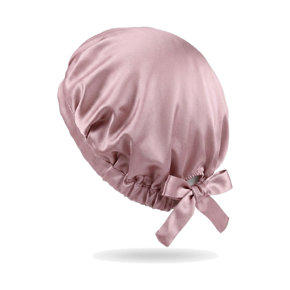 Coloris rose : bonnet de nuit en soie de mûrier sur fond blanc