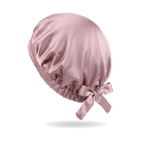 Coloris rose : bonnet de nuit en soie de mûrier sur fond blanc