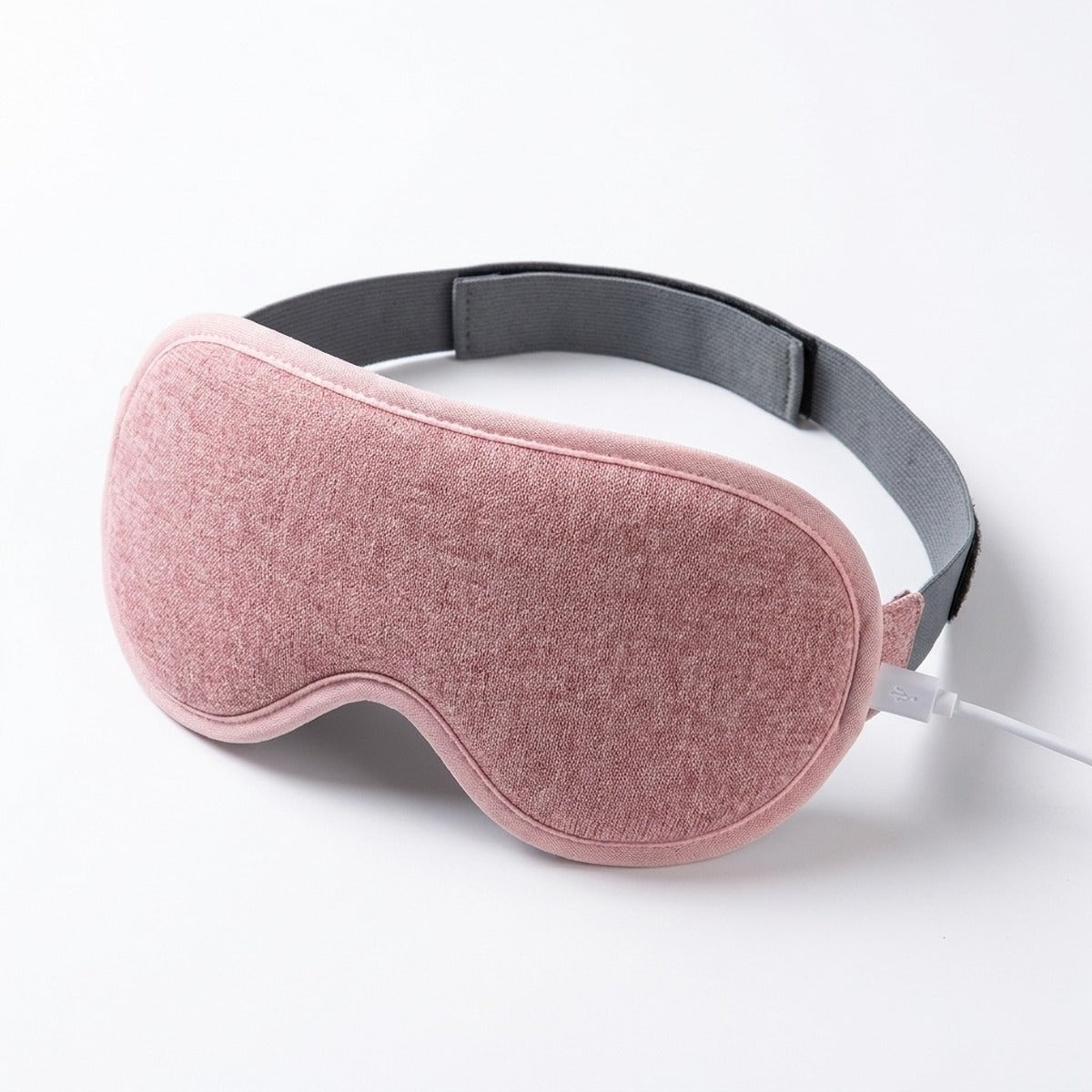 Coloris rose : masque chauffant pour les yeux sur fond blanc
