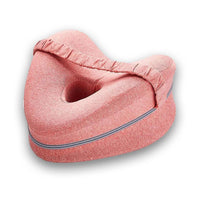 Coussin rose à deux faces profilées avec ouverture centrale et sangle élastique