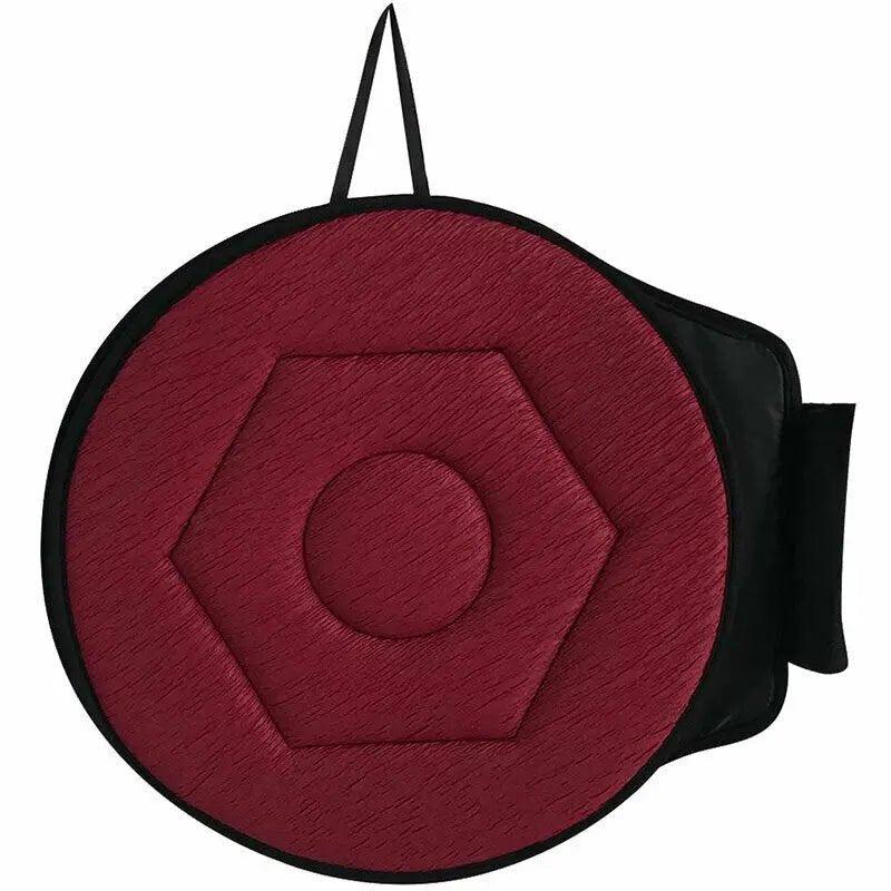 Coussin pivotant rond rouge bordeaux avec base textile visible