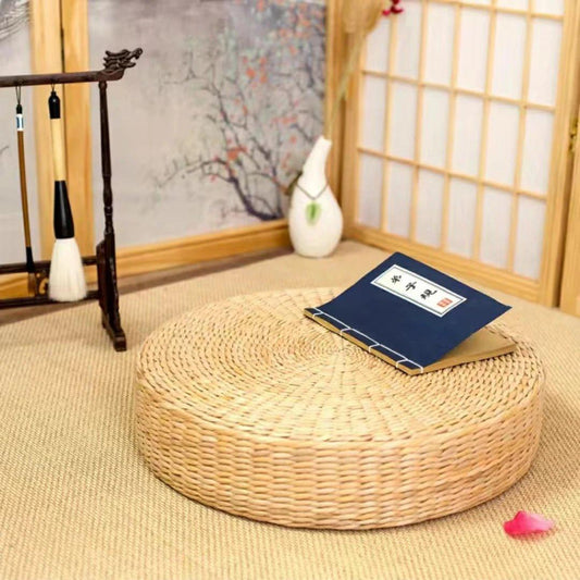 Coussin de sol rond beige clair à surface tressée