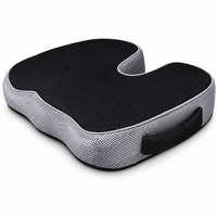 Coussin d’assise VibraSorb noir et gris, découpe en U et poignée — visuel retouché