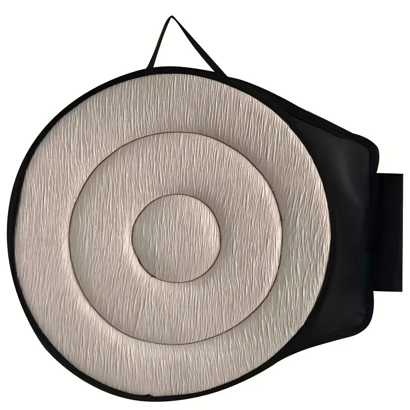 Coussin d'assise pivotant noir installé sur un siège, vue de face